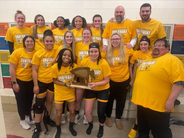 Women's basketball team players and coaches with women's basketball champions arrowhead athletic conference award